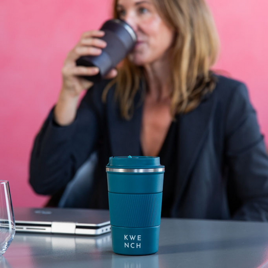 Girl drinking coffee from a Kwench stainless steel reusable coffee cup